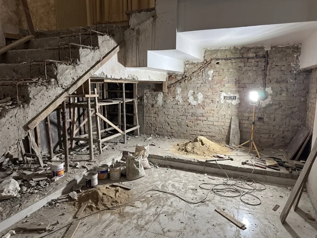 Foyer and staircase during demolition, before the transformation