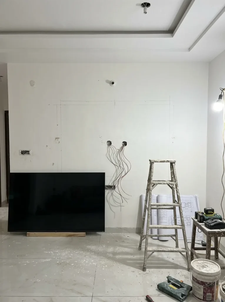 Living room wall marked out before the TV unit was built